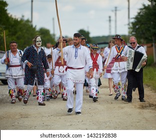 Uda, Romania, 20-06-2019: The folklore vocal and dance ensemble Calusarii Optasi performing at a fair outdoor