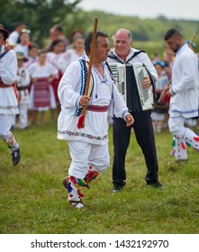 Uda, Romania, 20-06-2019: The folklore vocal and dance ensemble Calusarii Optasi performing at a fair outdoor