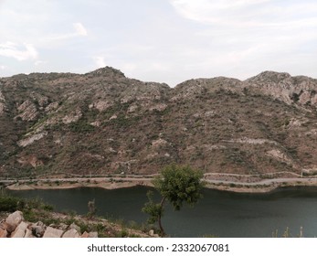 Udaipur, India - June 27 2020: Huge mountain at side of Lake | Badi Lake side of Big Hill