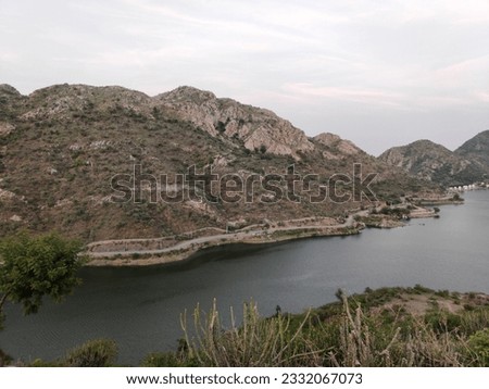 Udaipur, India - June 27 2020: Huge mountain at side of Lake | Badi Lake side of Big Hill