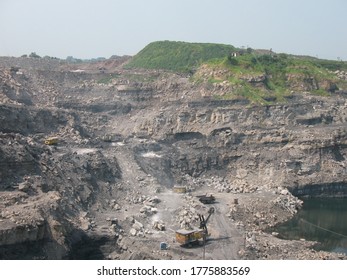 Udaipur, India - June 29, 2020 : A Mines In Dia With Operating Heavy Machinery Equipments And Dump Truck Earthmover.