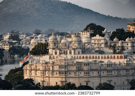 Udaipur lake palace and city at night. Beautiful scenic low light photography. Wall mounting. Seasonal greetings. Holiday tour destination. Destination wedding place.
