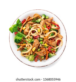 Udon Stir Fry Noodles With Pork Meat And Vegetables In A White Plate Isolated On White  Background.