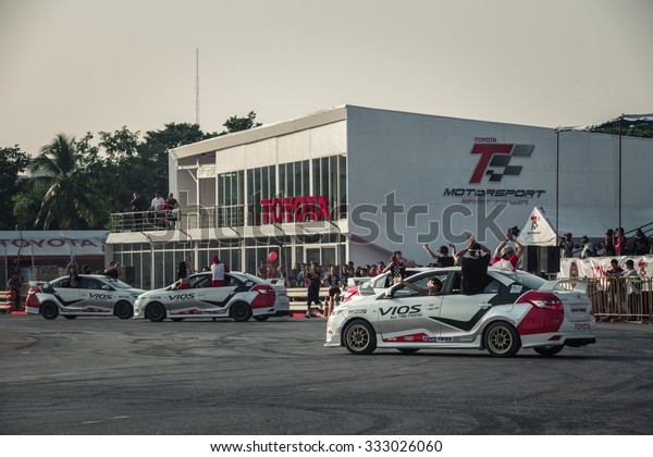 Udon Thani, Thailand - October 18, 2015: Toyota\
Colora Altis performance show at event Toyota Motor Sport show.\
This show is that the car carry a cheer leader for the dance show\
at the breaking time.