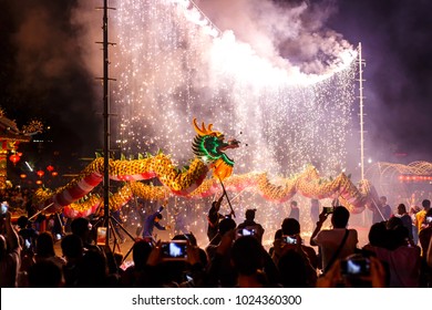UDONTHANI THAILAND, 12 Febuary 2018 :Dragon dance show under firework in the festival of 2018 Chinese New Year in the night at San Jao Pu Ya Udonthani ,Thailand