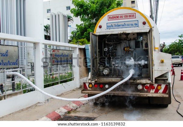 UDONTHANI, THAILAND - AUG.23,2018 Technician\
with car nitrogen and fill liquid nitrogen in storage tank at the\
hospital  in  Udonthani,\
Thailand