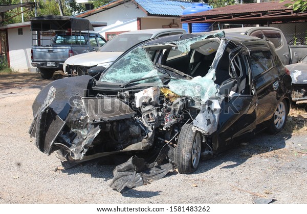 UDONTHANI,\
THAILAND – DECEMBER 7, 2019 :  The state of a decayed car that be\
inoperable thing,  after it had accident on road,  see it at the\
police station in UDONTHANI province\
THAILAND.