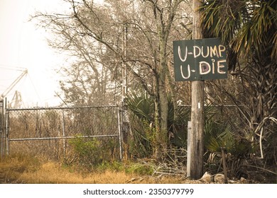 U-Dump U-Die, funny No Dumping Sign near construction zone
