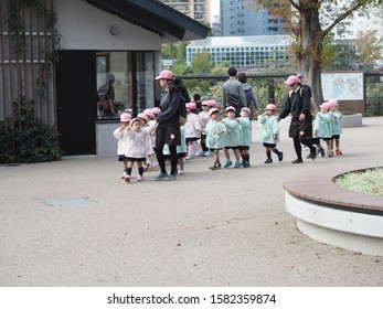 Ueno Tokyo Japan - November 14 2018 : Children Boys And Girls Line Up And Follow Teachers While They Field Trip In Zoo.