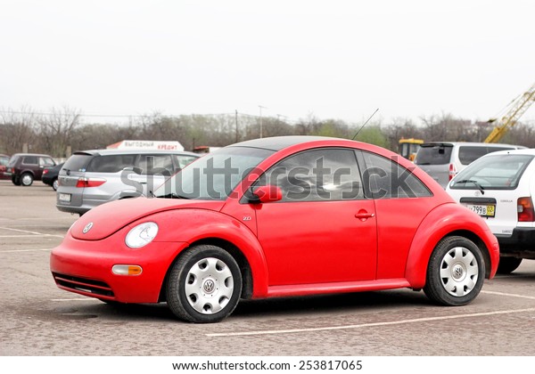 UFA, RUSSIA - APRIL 19, 2012: Red\
compact car Volkswagen Beetle in the used cars trade\
center.