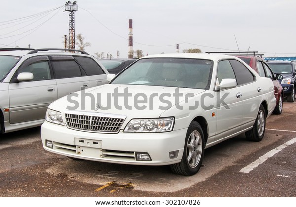 UFA, RUSSIA - APRIL 19, 2012: Motor car\
Nissan Laurel at the used cars trade\
center.