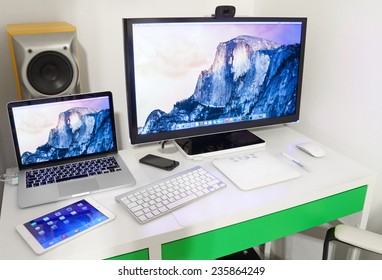 UFA, RUSSIA - DECEMBER 5, 2014: Photo Of A MacBook Pro And Ipad Mini 2, Iphone 5. MacBook Pro Retina Is A Laptop Developed By Apple Inc.