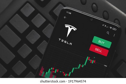 Ufa, Russia - February 16, 2021: Logo Tesla On Screen Smartphone. Rise And Fall Of Tesla Shares On The Stock Exchange. Buying And Selling.