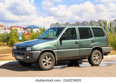 Ufa, Russia - July 28, 2012: Green Offroad Car Ford Maverick In A City Street.