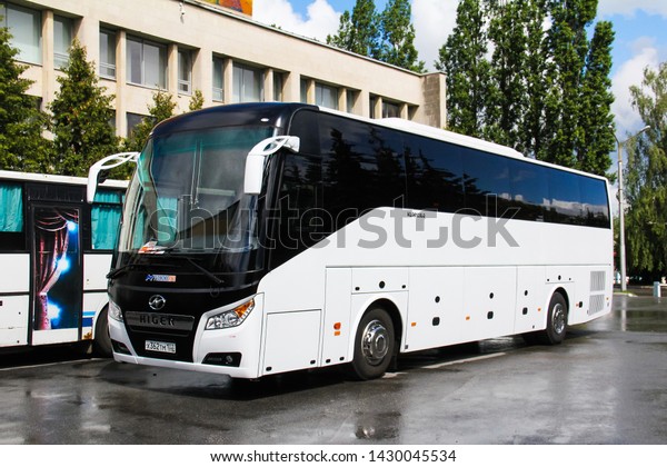 Ufa, Russia - June 15, 2019: White coach bus\
Higer KLQ6128LQ in the city\
street.
