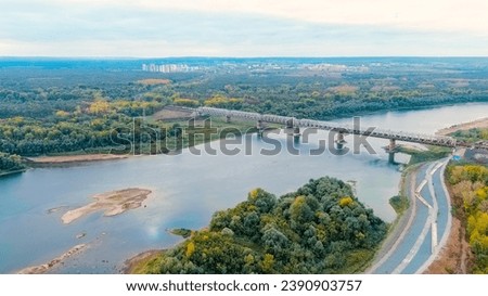 Ufa, Russia. Railway bridge across the Belaya River. The train follows the bridge, Aerial View  