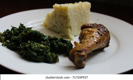 Ugali, Kales And Roasted Chicken. Typical Food In Kenya And Tanzania.