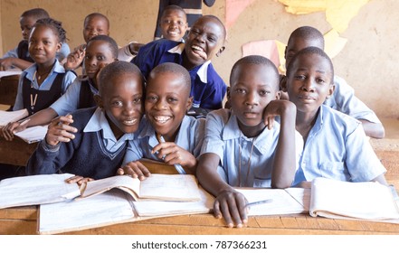 Uganda. June 13 2017. Smiling Ugandan children sitting at desks in a classroom in a primary school.