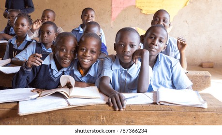 Uganda. June 13 2017. Smiling Ugandan children sitting at desks in a classroom in a primary school.