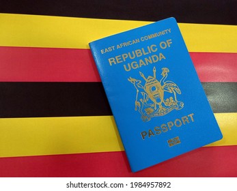 Ugandan Passport with flag background