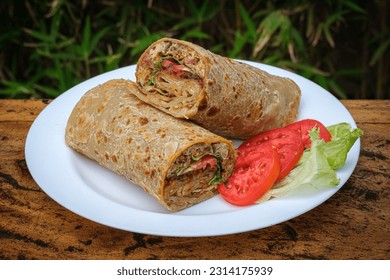 Ugandan Rolex, commonly referred to as Rolex, is a popular food item in Uganda, combining an egg omelette and vegetables wrapped in a chapati.