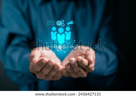 UGC, User generated content concept. Online marketing, Product reviews from the perspective of real users. Businessman holding UGC icon on virtual screen.	