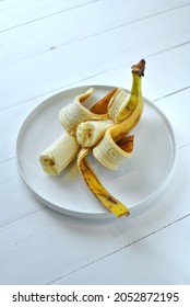 Ugly Banana On A White Plate.