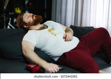 Ugly Fat Man Sleeps On The Couch After Eating Pizza And Playing Video-games