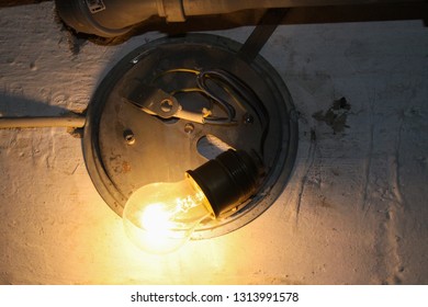 Ugly Lamp With Simple Naked Light Bulb In A Parking Garage