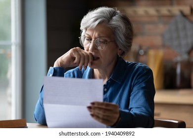 Ugly News. Distressed Old Age Hispanic Female Check Documents At Home Office Read Debt Bankruptcy Information In Financial Report. Upset Stressed Older Latin Woman Get Bad Surprise In Official Letter