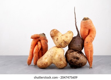 Ugly vegetables, close-up. Concept - Using in cooking imperfect products. Food organic waste reduction.