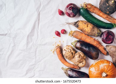 Ugly Vegetables On Grey Background. Ugly Food Concept. Top View, Flat Lay.