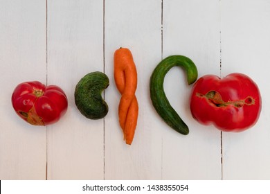 Ugly Vegetables On White Wooden Table. Horizontal Orientation, Top View