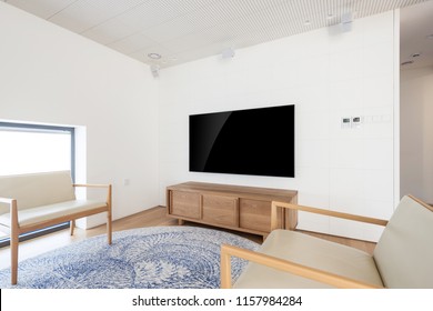 Uhd 65 Inch Tv In A White Indoor 