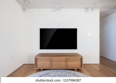 Uhd 65 Inch Tv In A White Indoor 