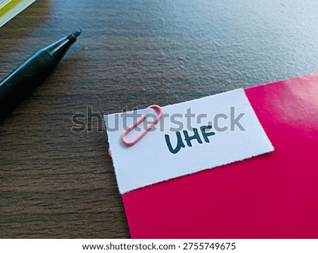 Uhf writting on table background. 
