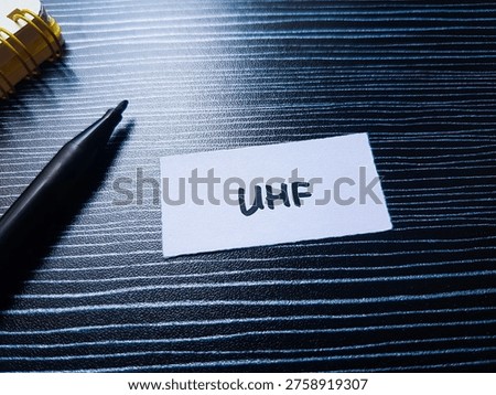 Uhf writting on table background. 
