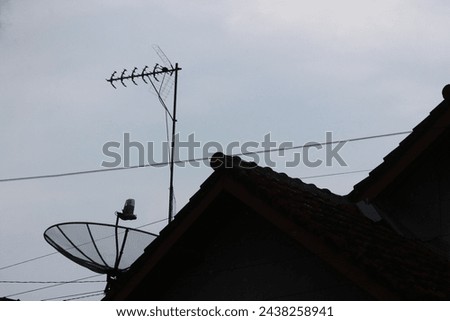 UHV antenna and parabolic antenna installed on the roof for television