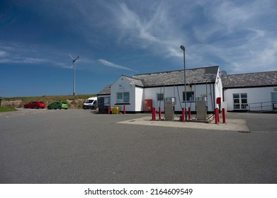 Uig, Isle Of Lewis, UK - June 6 2022: Exterior Of Uig Community Shop And Petrol Station. No People, Sunny Day With Blue Sky And Clouds.