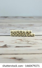 Uighur Genocide Word Make With Wooden Letter Cube On The Table.