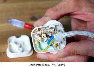 UK 13 amp domestic electric plug with back taken off to change the fuse