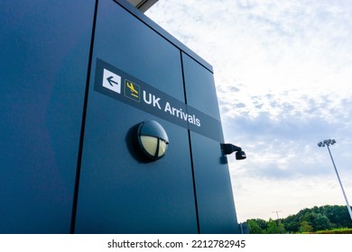 UK Airport Arrivals Sign Situated On The Exterior Of A Building In Stansted Airport.