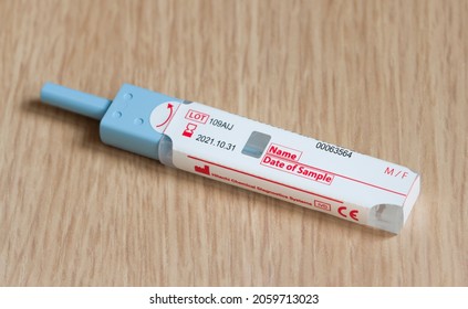 UK - April 21, 2021. Stool Test (FIT Or Faecal Immunochemical Test), A Fecal Occult Blood Test For Screening Bowel Cancer From A Stool Sample