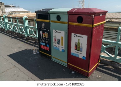 UK, Brighton, 22/6/2020 - Three coloured public waste and recycling bins in Brighton along the seafront 