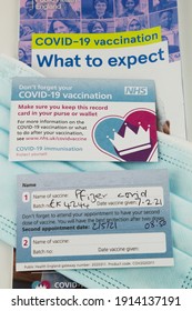 UK Covid Vaccination Record Card. Recipients Of The Pfizer Covid Vaccine Are Given A Vaccination Card And Instructed To Return For A Booster. Wythenshawe, Manchester, UK February 2021