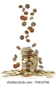 Uk Currency Falling Into A Savings Jar