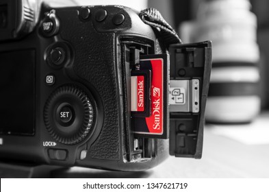 UK - February 08, 2019. Sandisk SD And Compact Flash CF Memory Cards In A Canon Camera Slot. Sandisk Is The Leading Brand Of Memory Cards For Photographers.