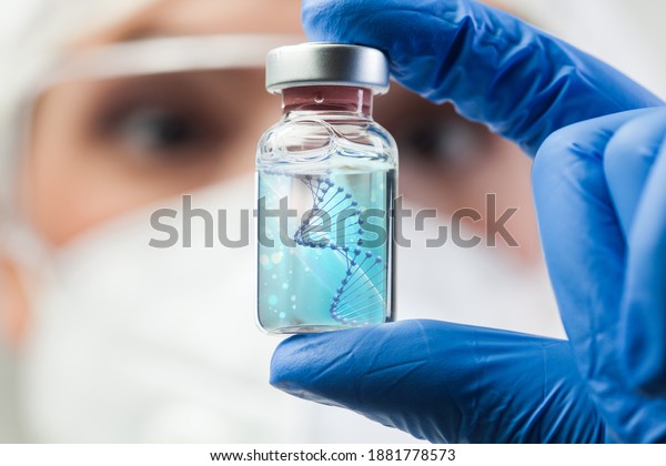 UK lab scientist biotechnologist holding glass ampoule vial with DNA strand,molecule of two polynucleotide chains forming double helix carrying Coronavirus genetic instruction,new strain RNA mutation