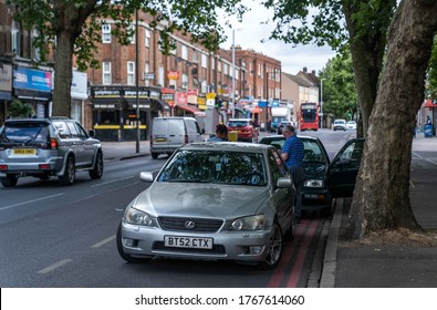 UK, London, 1/7/2020 - Two Drivers Exchanging Insurance Details After A Car Collision In London