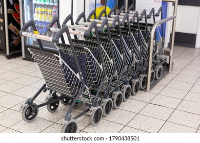 UK London 24.01.2020: Row, Lot Of Free Strollers For Carrying, Transporting Kids, Children By Mom, Family Passengers In Airport. Small Baby Sit And Wait For Flight Depature, Arrival Of Other Baggage.